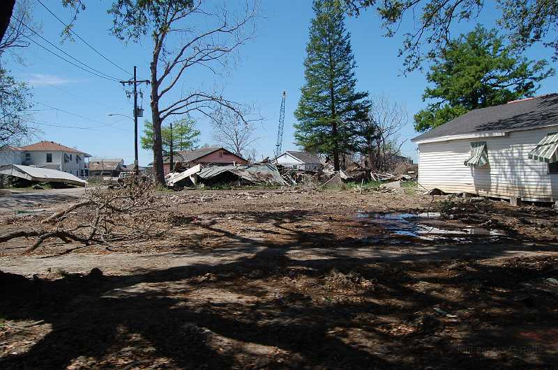 New Orleans 04-08-06 030.JPG - Houses that presented a hazard have been bulldozed.  Others await their turn.